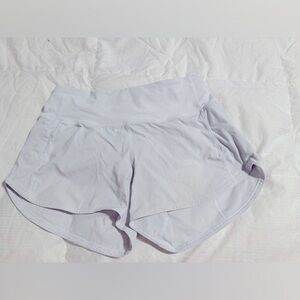 White Lululemon 4inch Speed Up shorts.  Size 4.